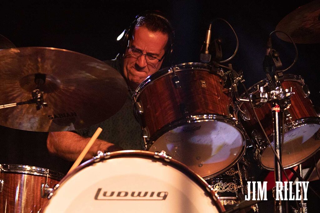 Jim Riley on drums